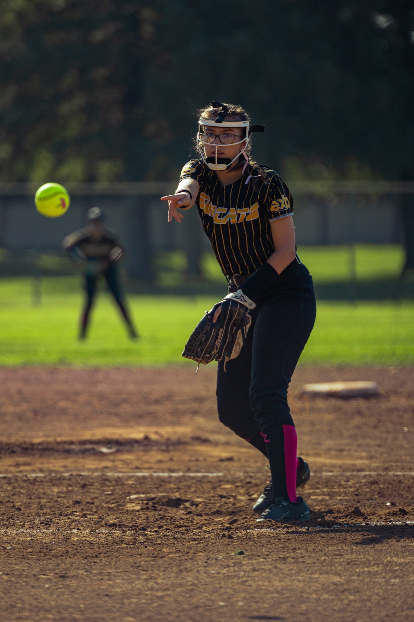 Softball pitcher releasing ball